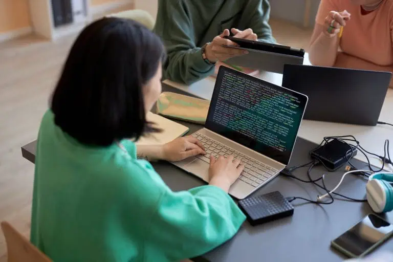 a woman doing medical coding on her computer