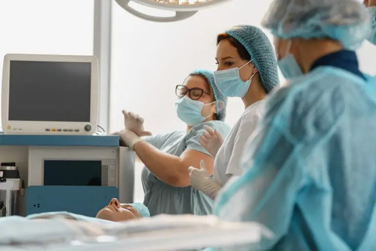 a surgical team working in an operating room which emphasizes the importance of medical billing for surgery centers