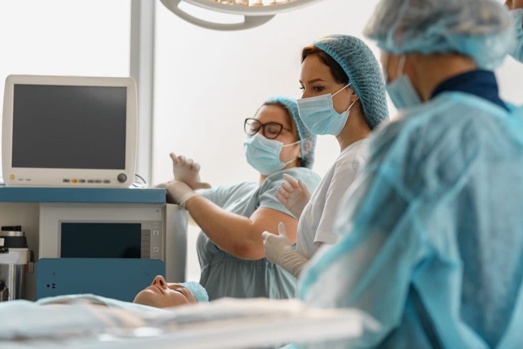 a surgical team working in an operating room which emphasizes the importance of medical billing for surgery centers